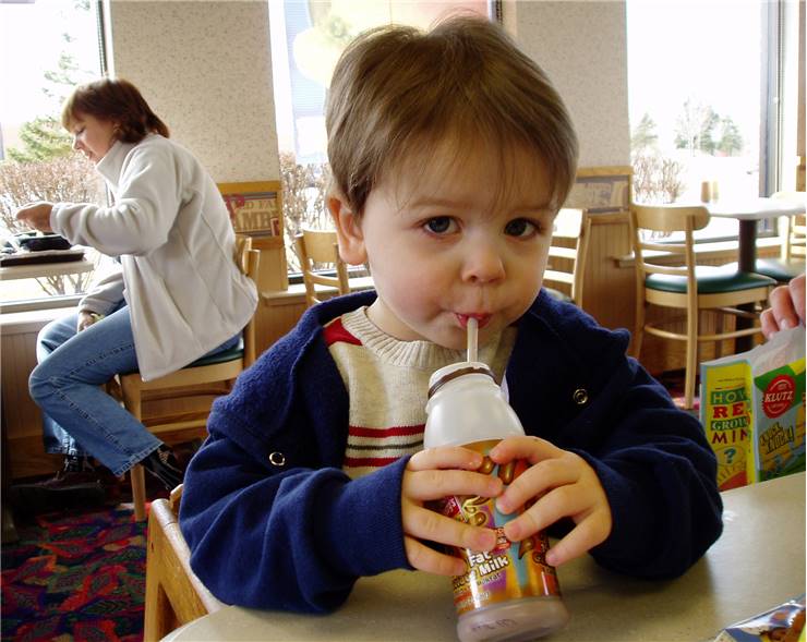 Boy with chocolate milk